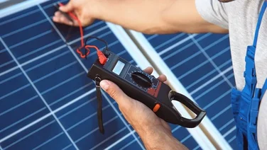 engineer taking solar panel reading