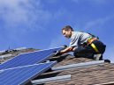 specialist installing solar panels