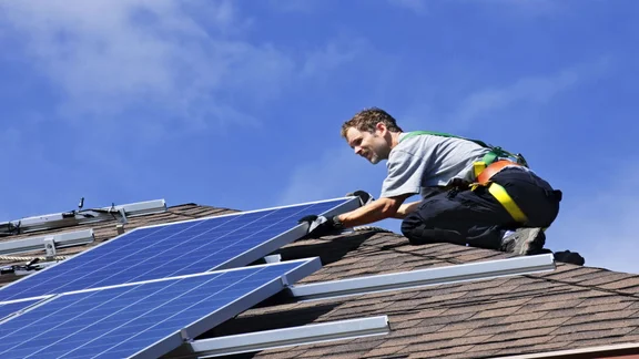 specialist installing solar panels