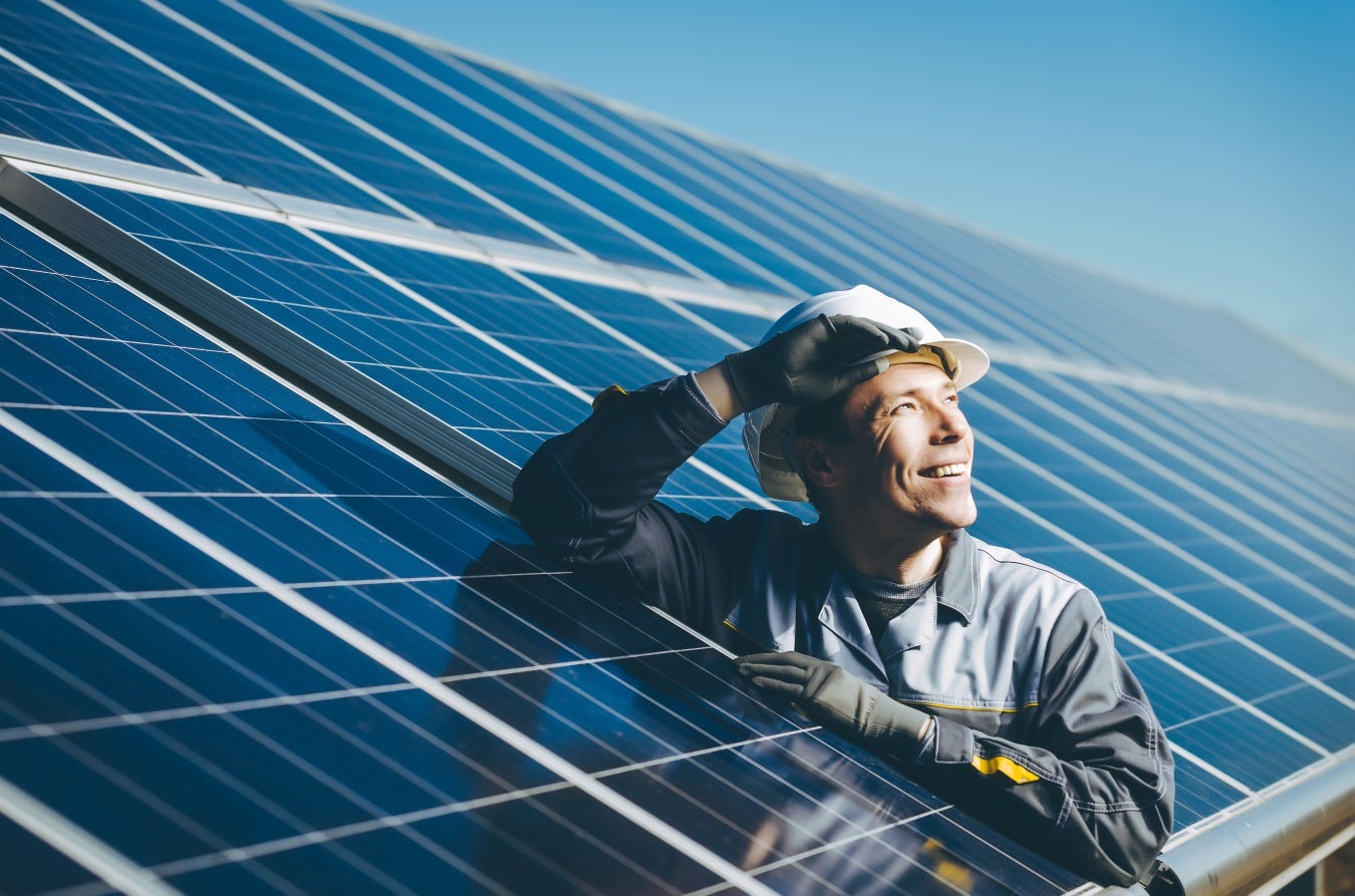 man installing solar energy