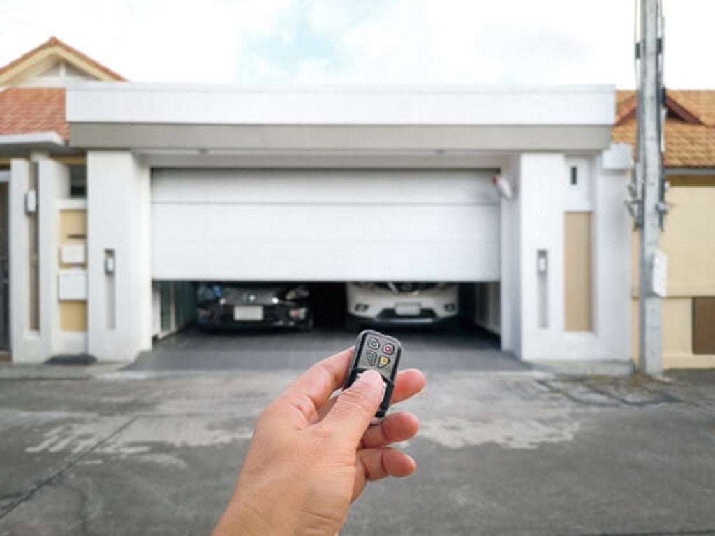 a man opens a smart garage door