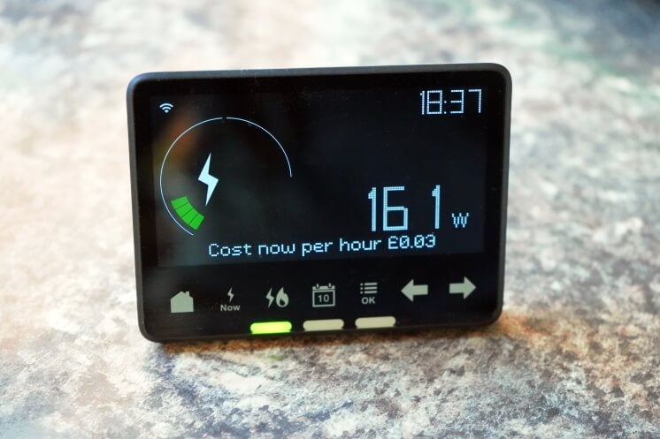 a smart meter's in-home display on a grey table