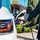 an arm plugging an electric vehicle charger into an electric vehicle