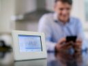 man uses smart meter through mobile app
