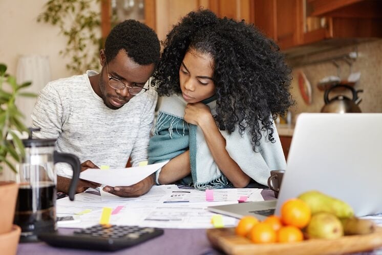 a couple looking at energy bills