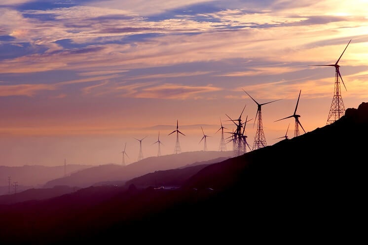 Wind turbines in a sunset 