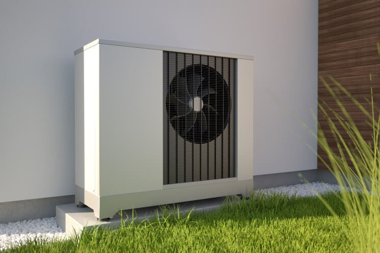 air source heat pump outside a home