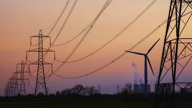 National Grid pylons against a sunset