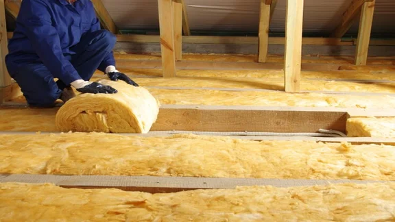 insulation being installed in a loft
