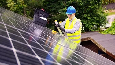 Someone installing solar panels