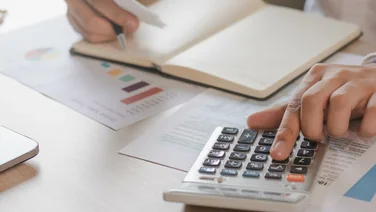 person calculating their bills
