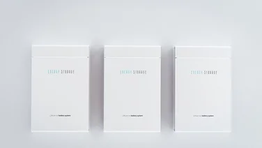 three white energy storage battery installed in a row on white wall