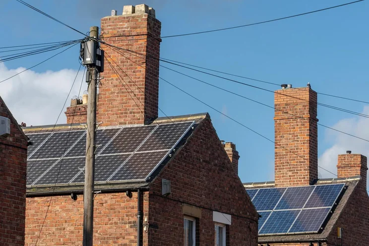 Solar panels on the roofs of terraced houses in the UK