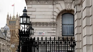 A view of the entrance to Downing Street in Westminster with the Houses of Parliament building in the background