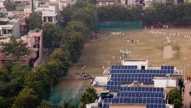 Solar panels next to a cricket pitch in Noida Delhi, Uttar Pradesh, India