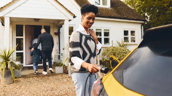 Plugging an EV charger into a car