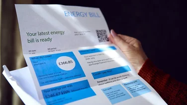Close Up Of Senior Woman Opening UK Energy Bill Concerned About Cost Of Living Energy Crisis
