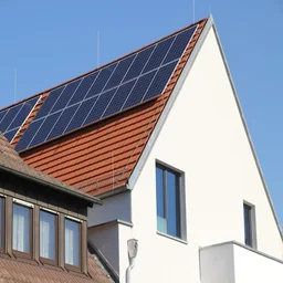 solar panels on a roof against a blue sky