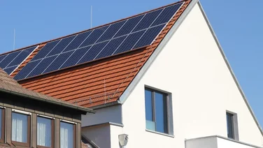 solar panels on a roof against a blue sky