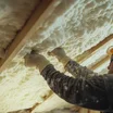 Insulation being installed between rafters