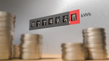 Money in front of a gas meter