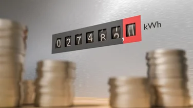 Money in front of a gas meter
